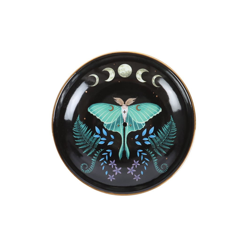 Decorative plate with a butterfly design on a black background
