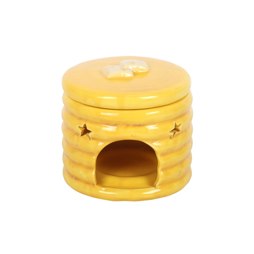 Yellow pancake-stack ceramic oil burner with syrup glaze and star cutouts, front opening for fragrance.