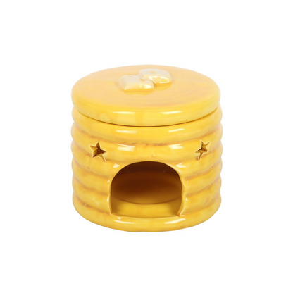 Yellow pancake-stack ceramic oil burner with syrup glaze and star cutouts, front opening for fragrance.