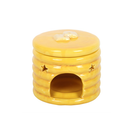Yellow pancake-stack ceramic oil burner with syrup glaze and star cutouts, front opening for fragrance.