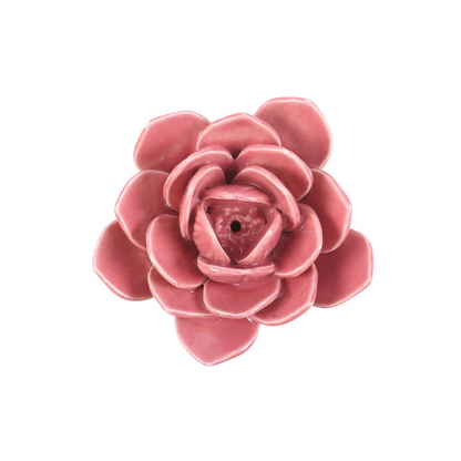 Pink ceramic flower on a white background
