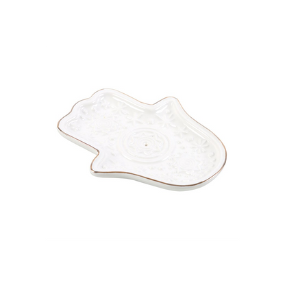 White ceramic hanger-shaped dish on a white background