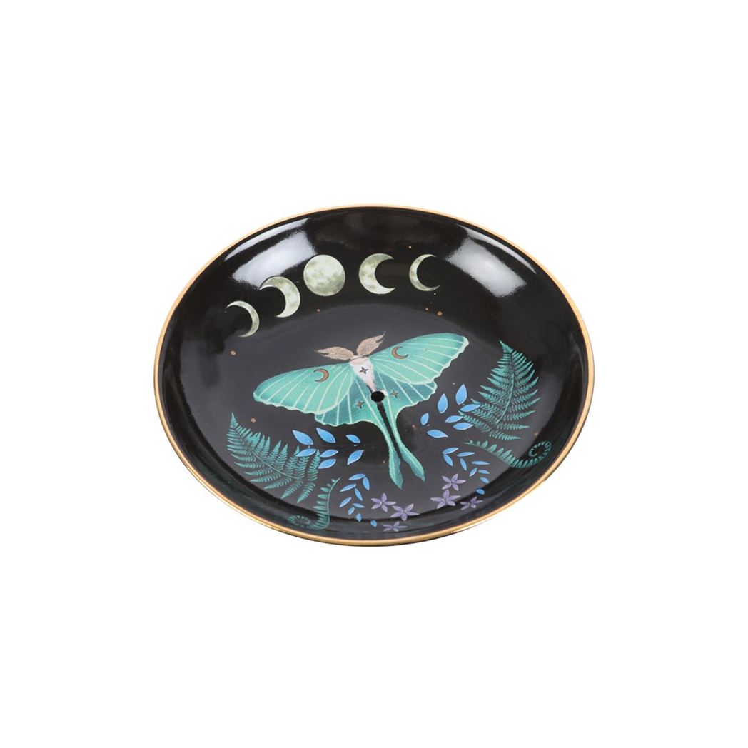 Decorative plate with a butterfly design on a black background